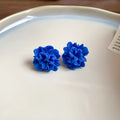 Geometric women's earrings with round elements in Silver Needle-blue colour on cloth material