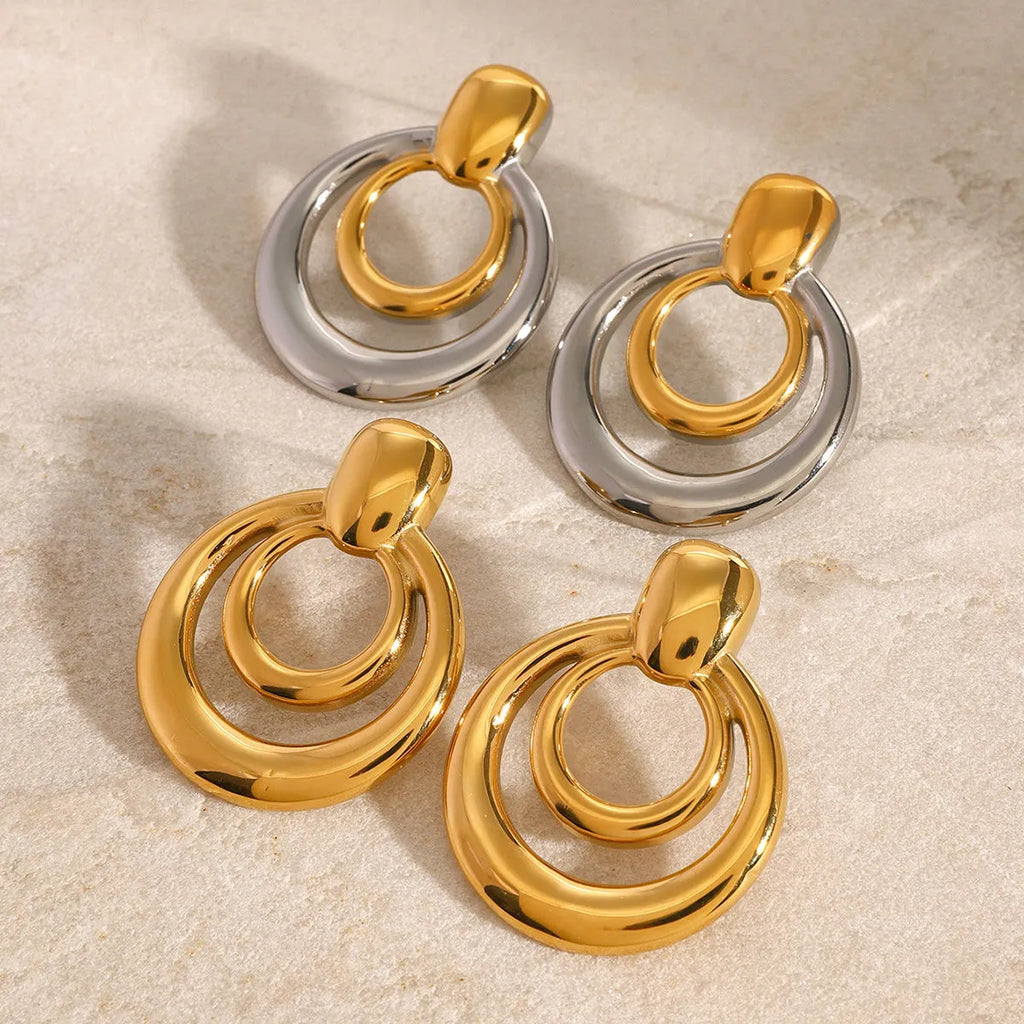 Round double layer hollow stud earrings with geometric design in electroplated 18K gold finish