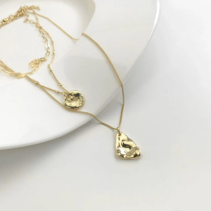 Multi-layer unisex clavicle chain with geometric triangle pendant and snake bones chain