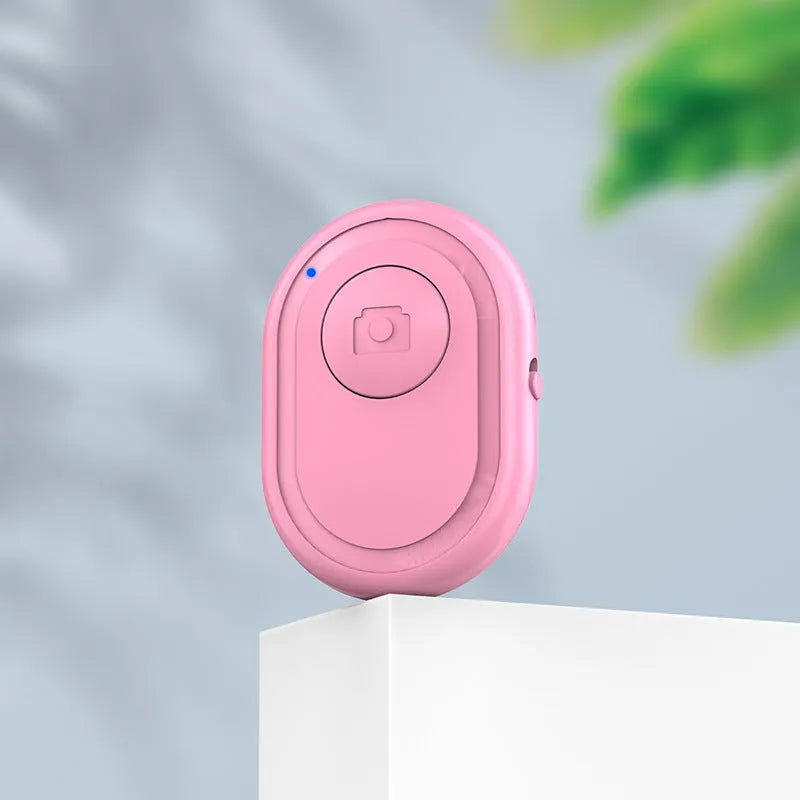 Wireless Bluetooth camera remote control in black, pink and purple colours
