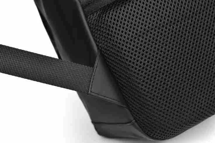 Men's large black waterproof PU backpack showing sewing thread detail and separate computer bag.