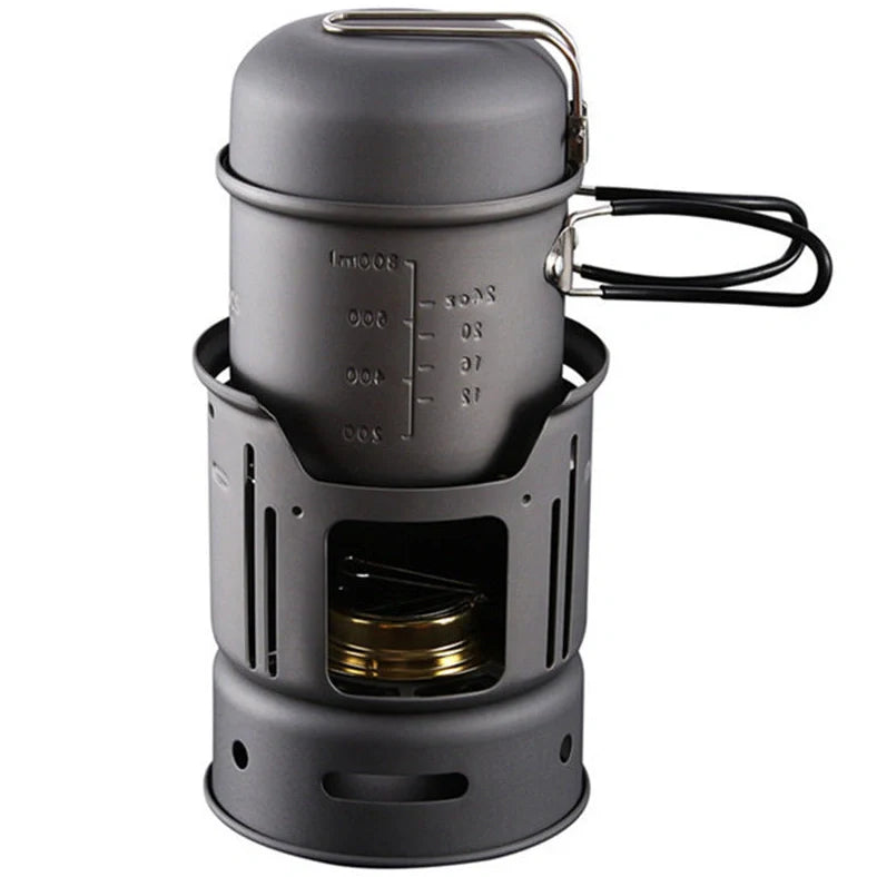 Small black stainless steel camping cookware set with alcohol stove and components