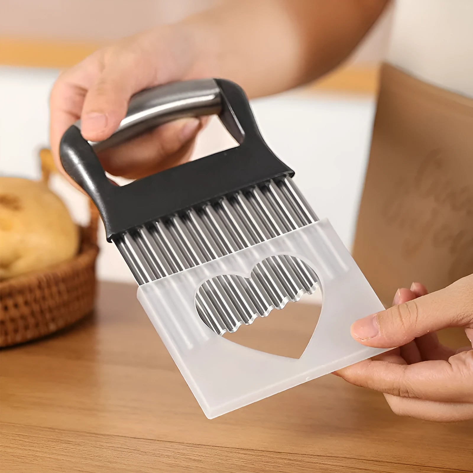 Stainless steel potato wave cutter knife on a kitchen counter, shown in black and white colour options.