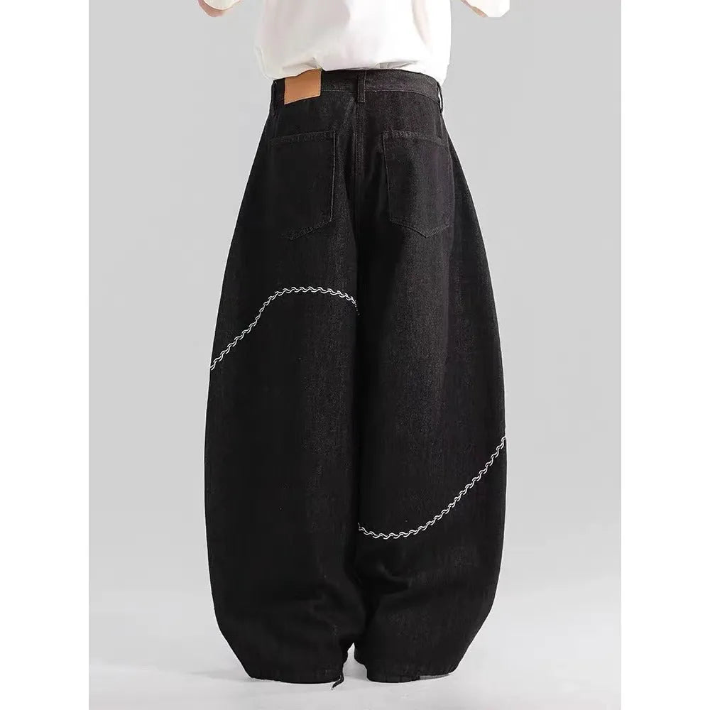 Black straight-leg polyester denim trousers with a zip fly and micro-elastic waistband.