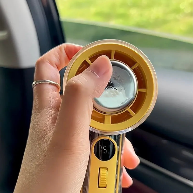 Small handheld fan with ice compress function in black, white, or yellow colours, showing portable size.