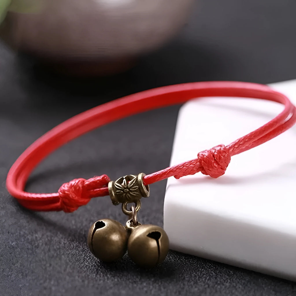 Adjustable nylon dog collar with brass buckle and optional brass bell in black, red, or coffee rope.