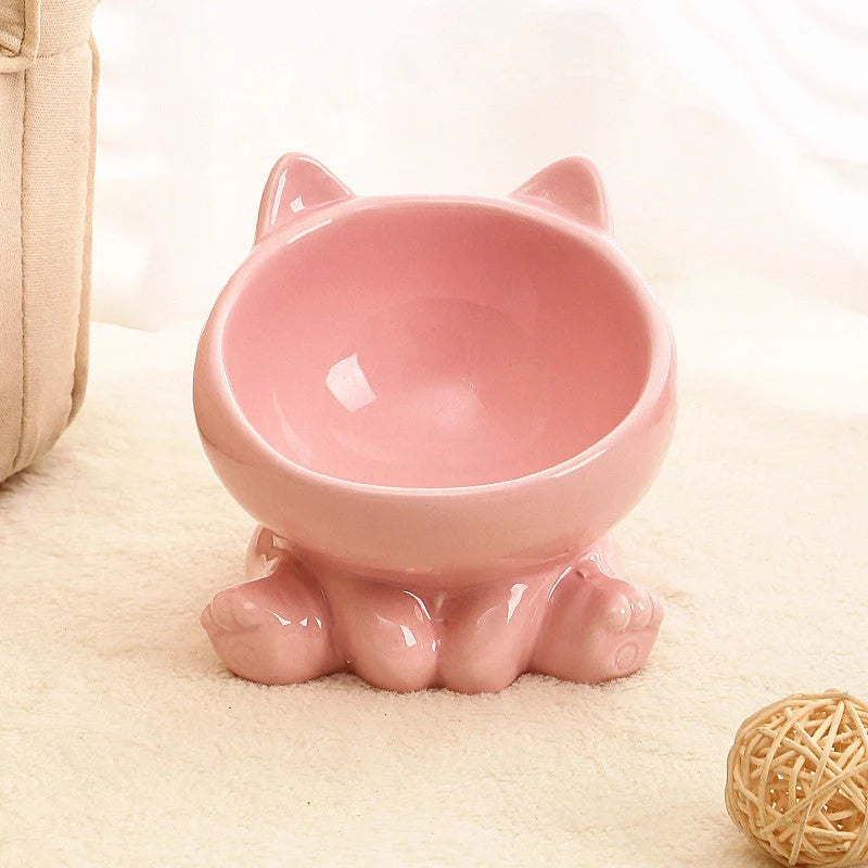 Ceramic pet bowl with neck guard and oblique mouth design in pink and blue