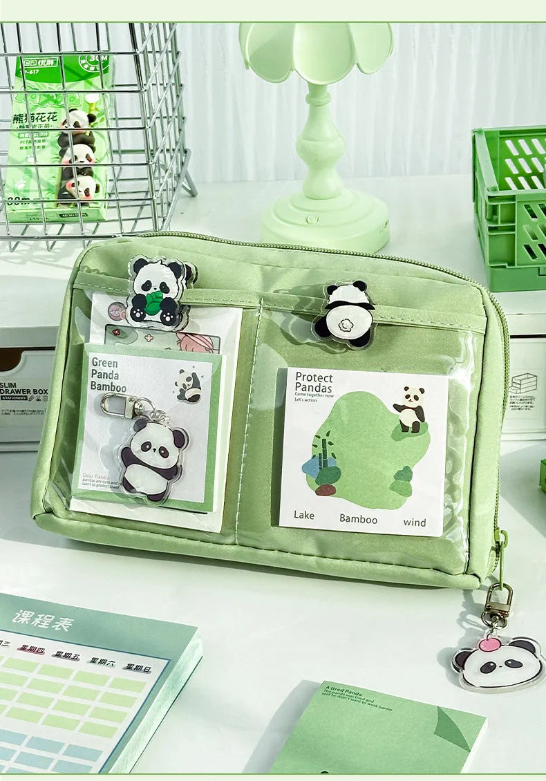 Green canvas 12-layer panda pencil case with zip closure, shown open to reveal compartments.