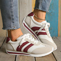 Wine red Cortez-style casual sneakers with a cross-strap detail and mesh lining.