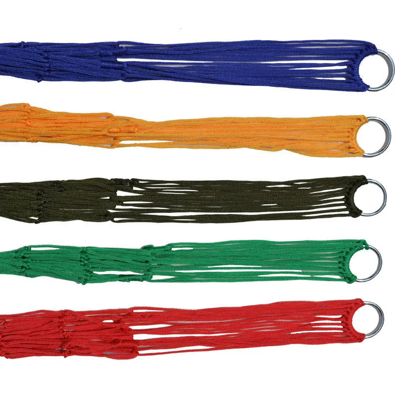 Outdoor Supplies 9-strand nylon rope hammock in red hanging between trees in a garden