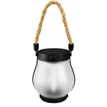 Flickering flame garden lamp with translucent shade in outdoor garden setting
