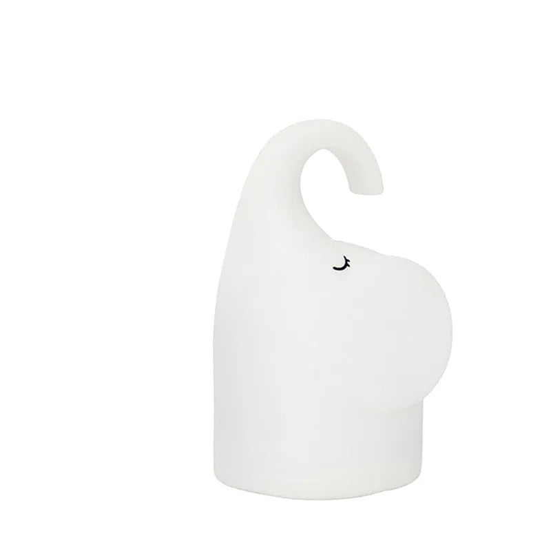 White DOMI elephant-shaped cordless silicone night light on a surface.