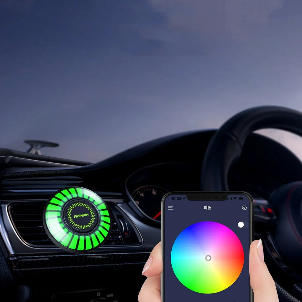 RGB car air outlet aromatherapy light with 3D rhythm effects mounted in a car vent.