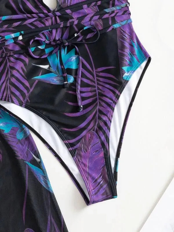 Women's three-piece polyester swimsuit set with matching coat in one of four available colour patterns.