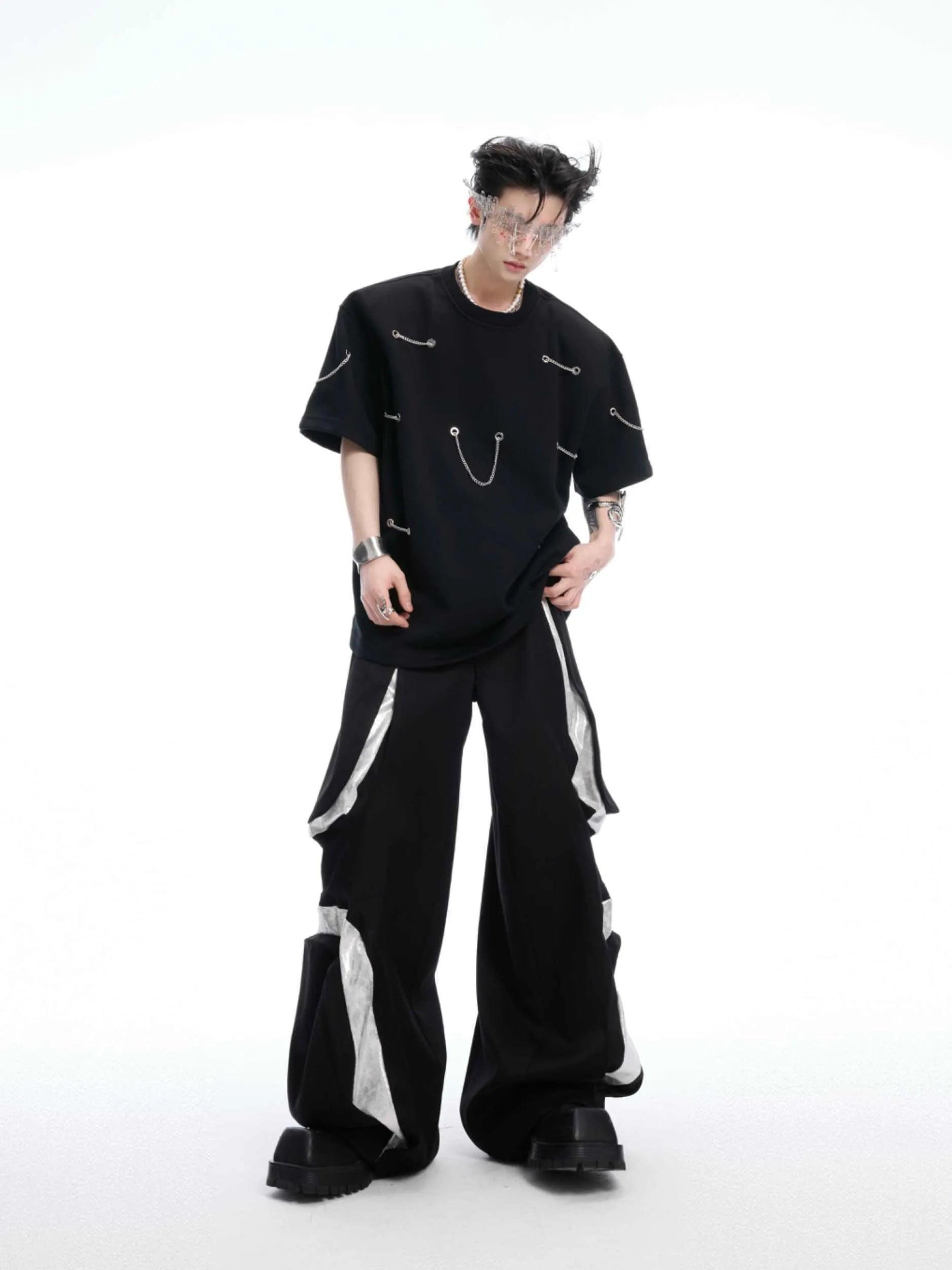Black heavy cotton t-shirt with padded chain shoulder detail on short sleeves