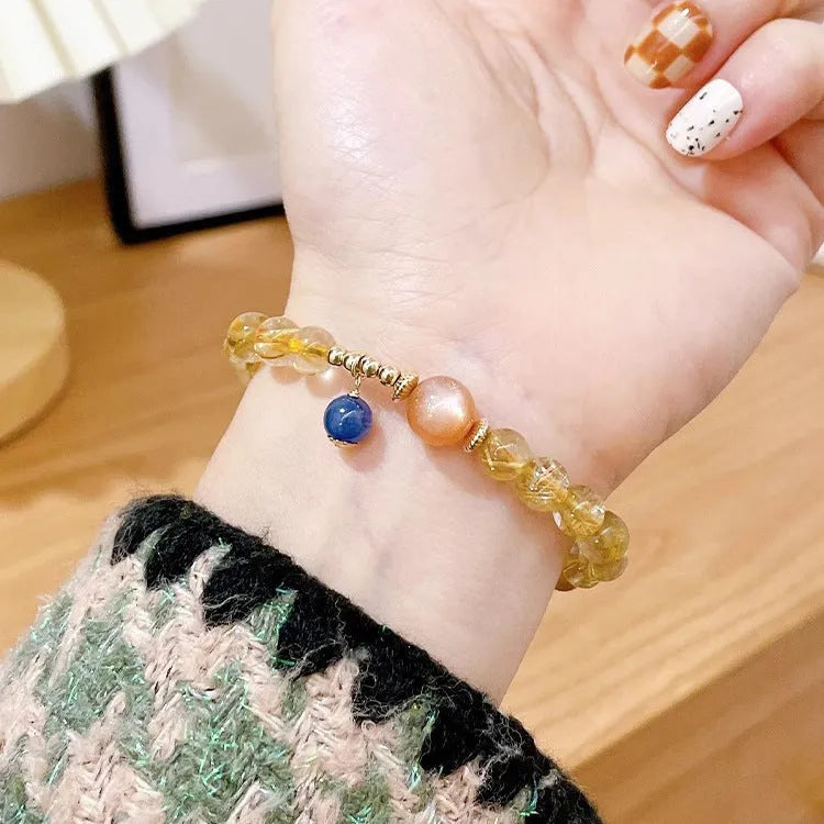 Gold rutilated quartz and sunstone bracelet with round diamond-cut beads for women