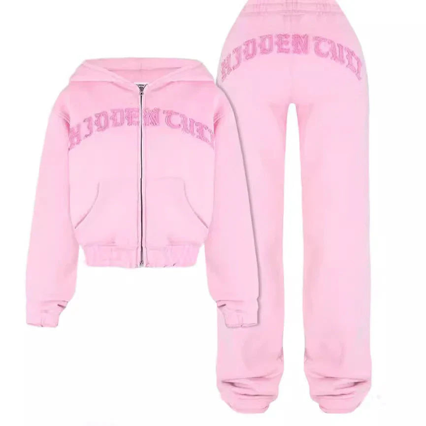 Stylish sports set featuring a cropped hooded sweatshirt with a trendy 3D effect design and relaxed drawstring pants in various colors