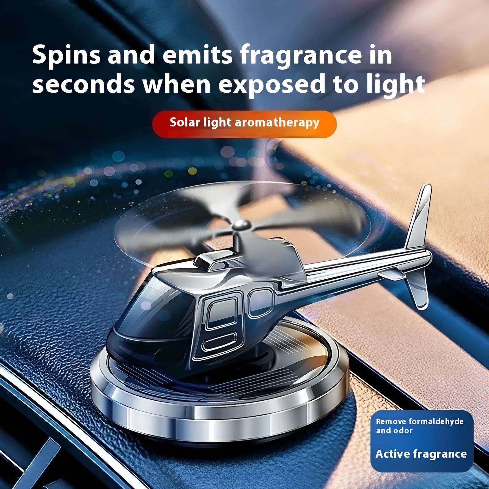 Silver metal solar helicopter car perfume ornament rotating on a car dashboard.