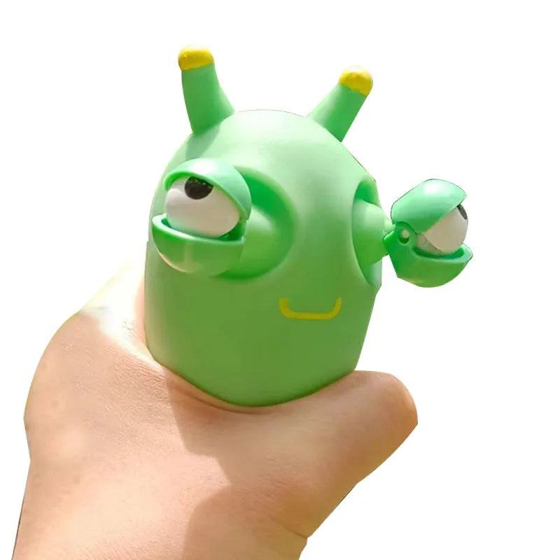 Green caterpillar squeaky toy with eye-popping feature, 8cm long PVC decomposition prank item