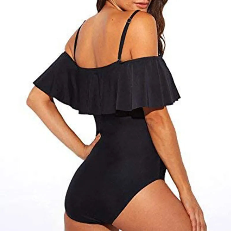 Black one-piece swimsuit with cut-out sides and ruffled strap tube top design