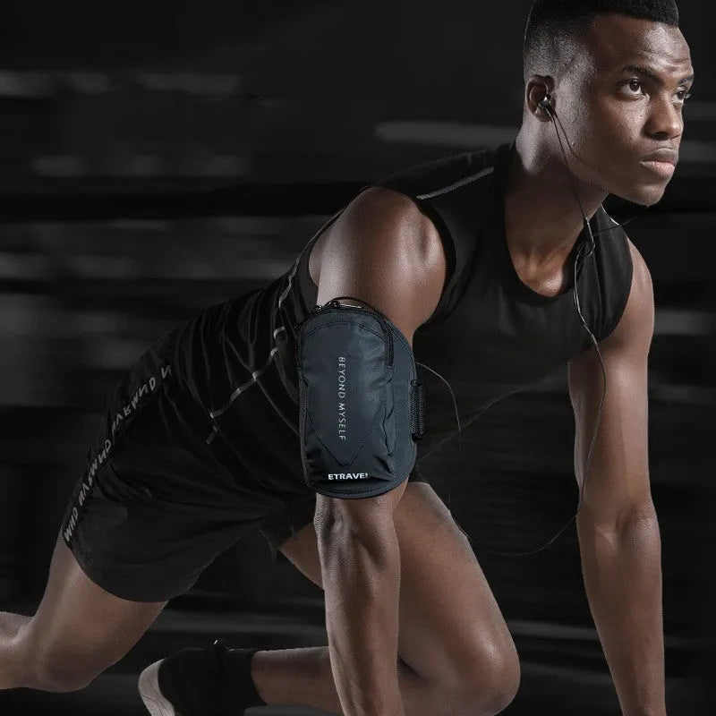 Reflective black running arm bag with adjustable strap shown on an arm.
