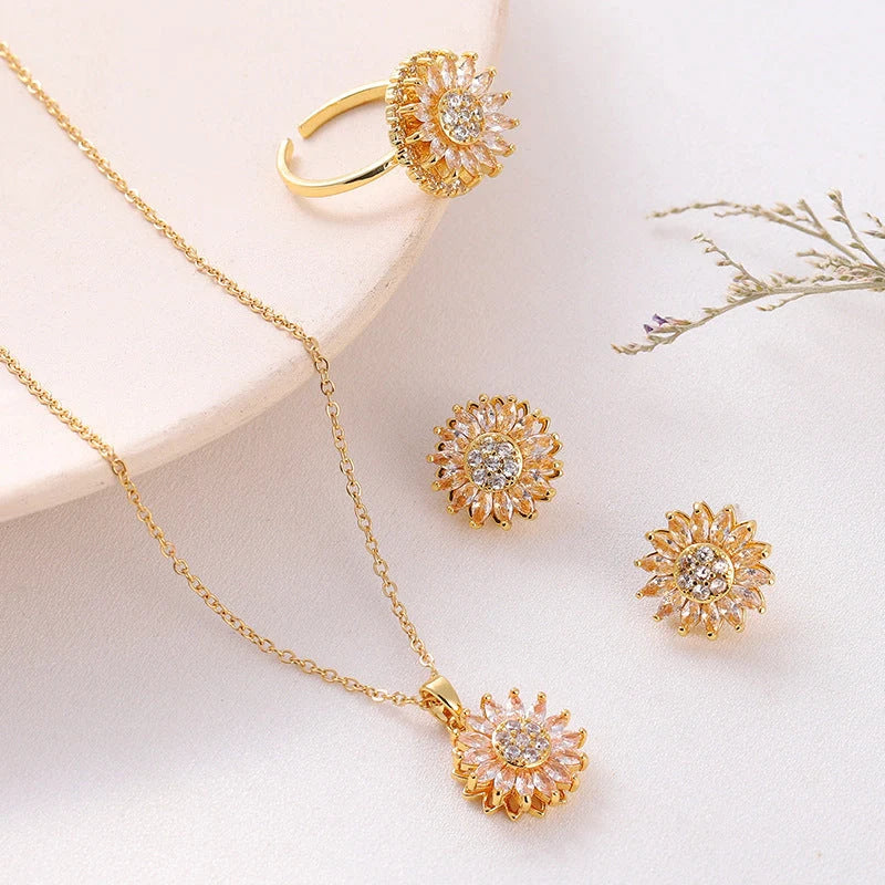 Sunflower-themed stainless steel jewellery set with zircon accents, including necklace, earrings, and ring