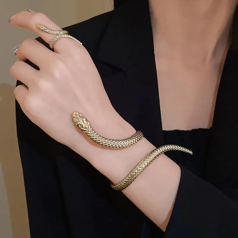 Gold twisted snake bracelet and ring jewellery set with exaggerated winding design