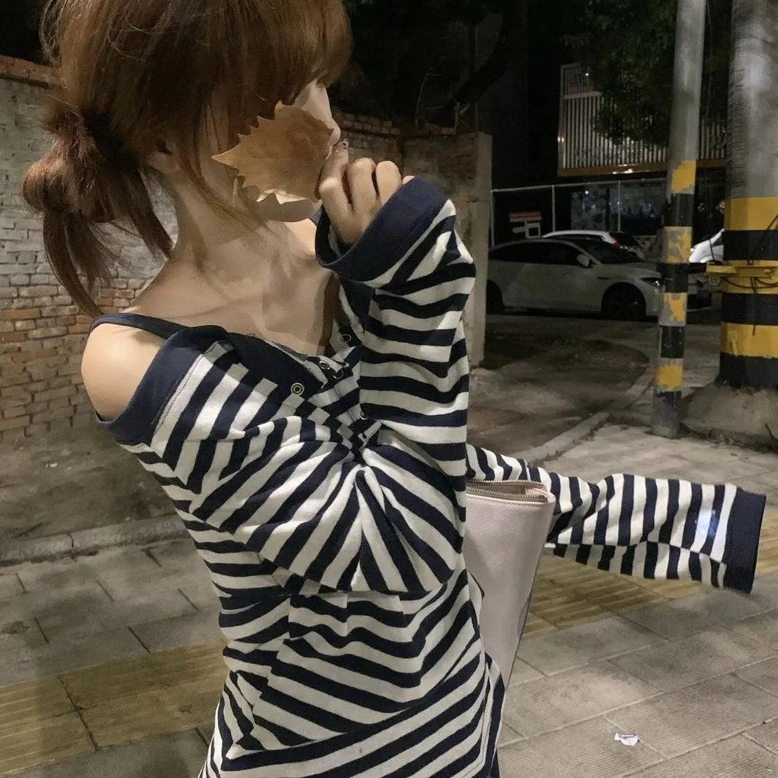 Dark blue Korean-style oversized women's t-shirt with long sleeves, stripes, and embroidery details.