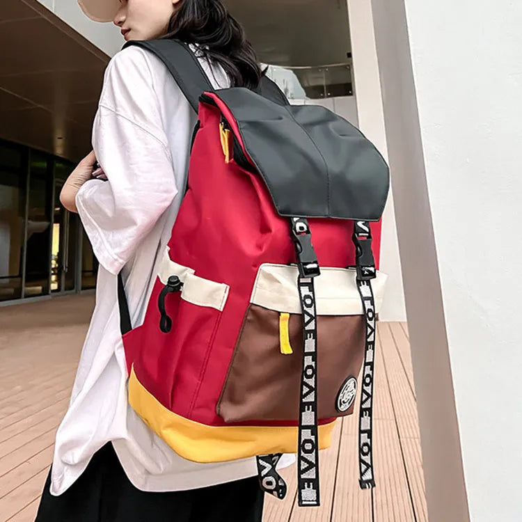 Black oxford cloth backpack with adjustable straps, shown next to green and red colour options.