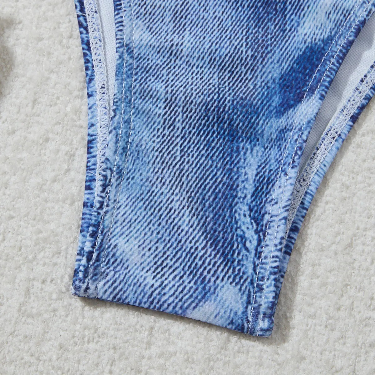 Denim blue printed bikini set with criss-cross straps on the top.
