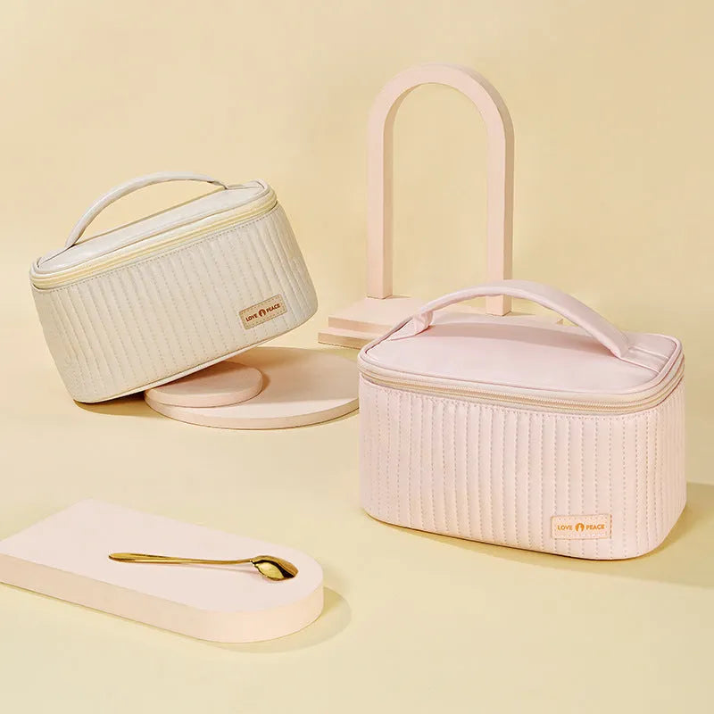 Open-top cake-shaped women's makeup bag in PU leather, shown in a choice of solid colours.