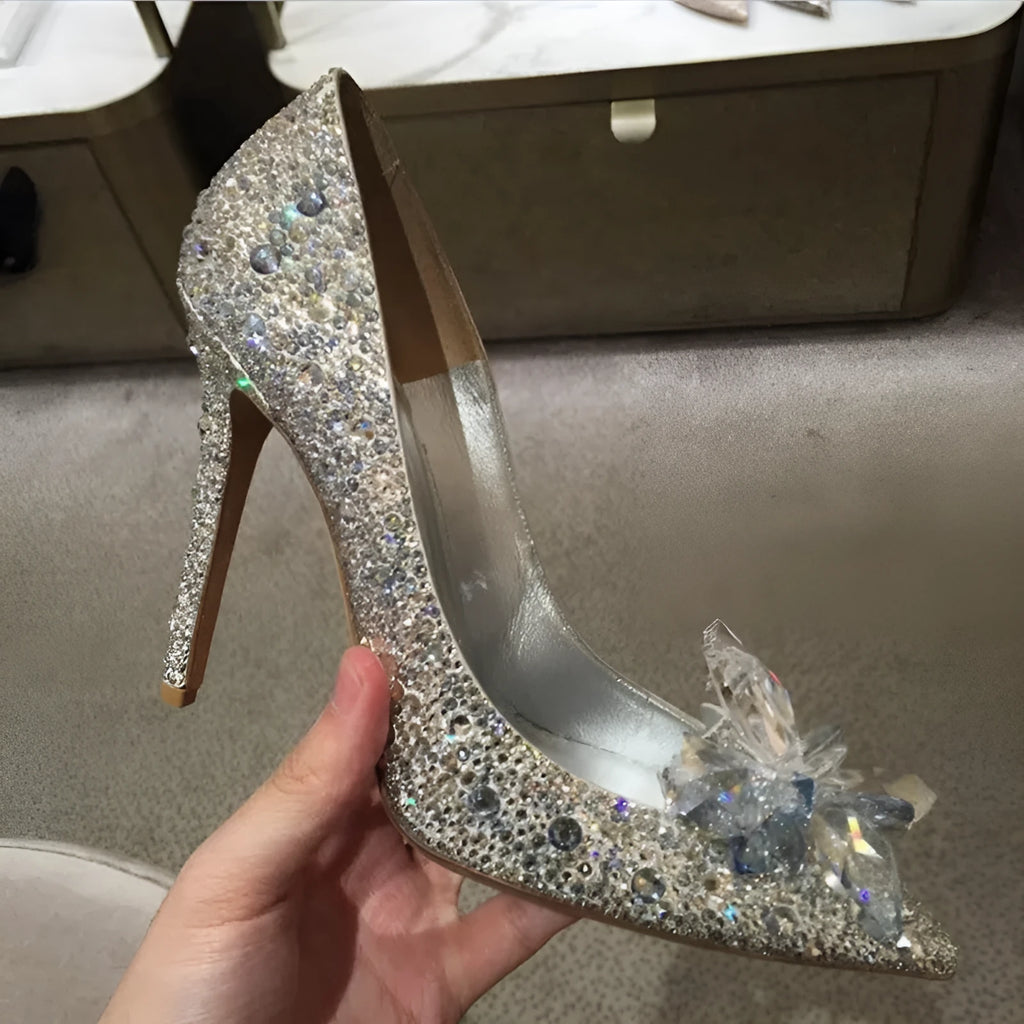 Women's gold sequinned pointed toe high heels with rhinestone details and a stiletto heel.