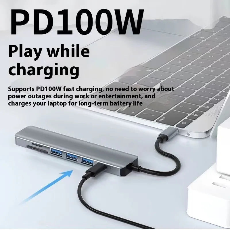 Type-C 7-in-1 expansion dock with HDMI port, USB ports, and a 15cm cable connected to a laptop.