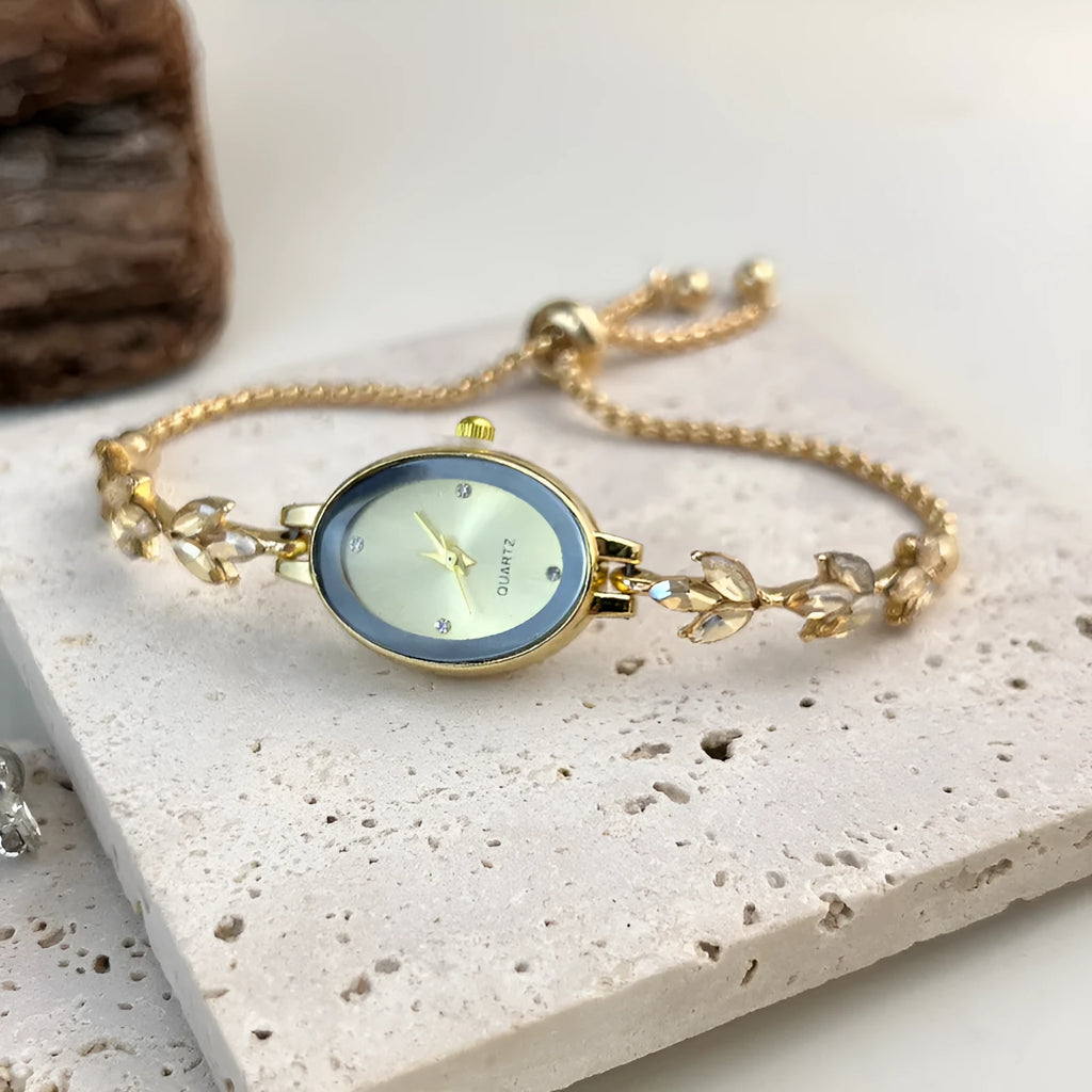 Women's oval retro quartz watch with alloy strap, 33mm dial, in gold colour on white background