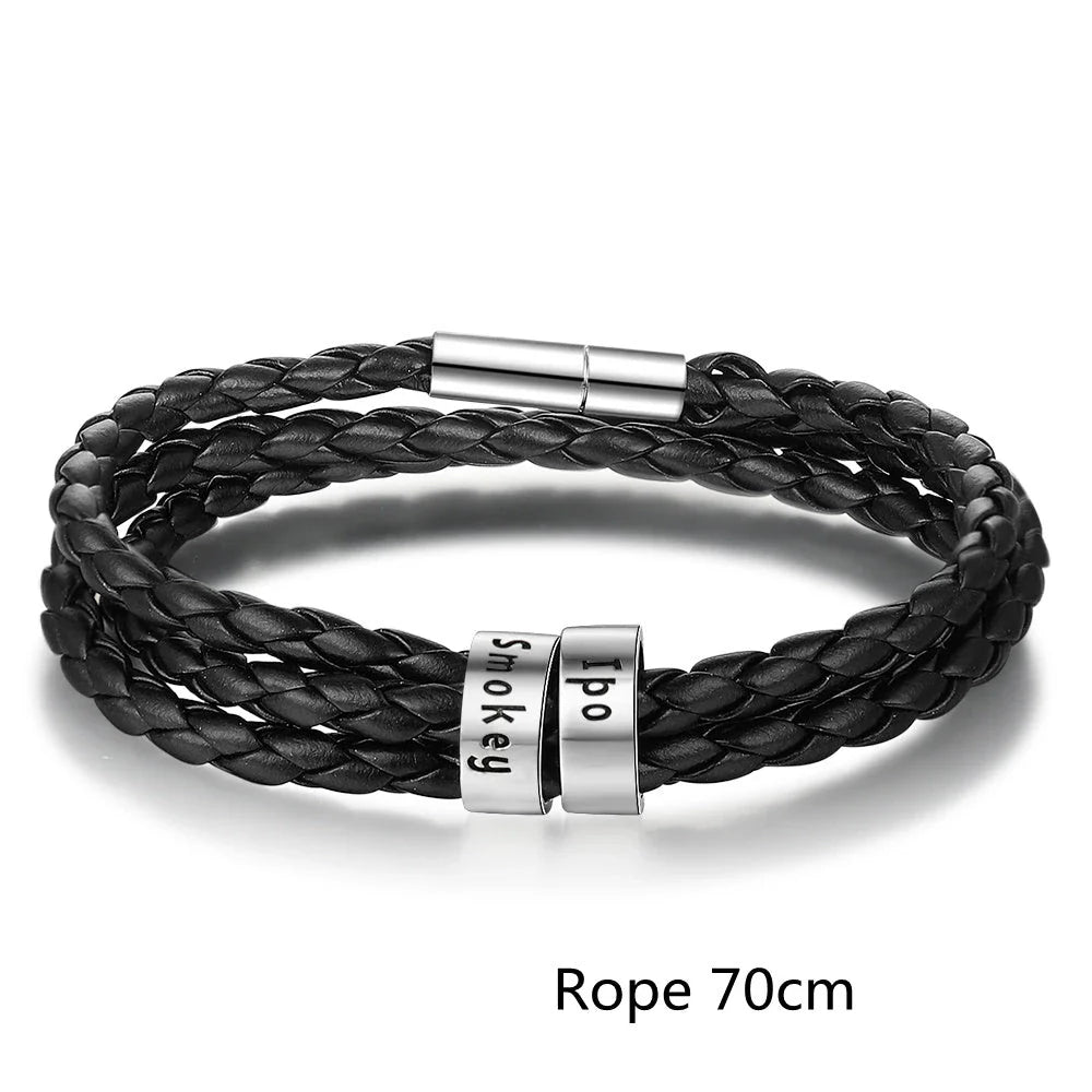 Personalized braided leather bracelet with engraved charm for men, available in black, brown, and navy colors