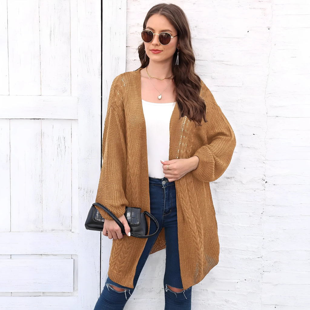 Women's loose brown acrylic sweater coat showing front detail and casual fit.