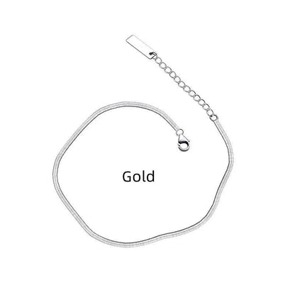 S925 silver snake bone chain anklet in silver and gold finishes, showcasing unique design and craftsmanship.