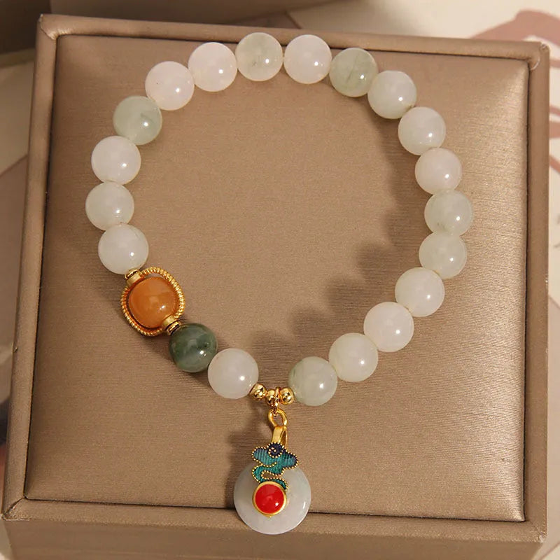 Women's ice jade bracelet with pearl accents and traditional jade buckle