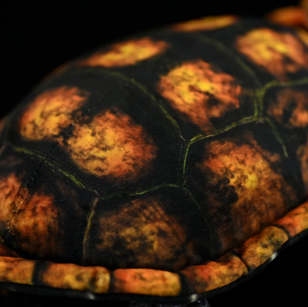 Coffee-coloured Japanese stone turtle plush toy 32cm from mouth to tail on neutral background