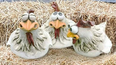 Vibrant resin chicken garden decor with comical expressions, adding a touch of Kiwi charm to outdoor spaces