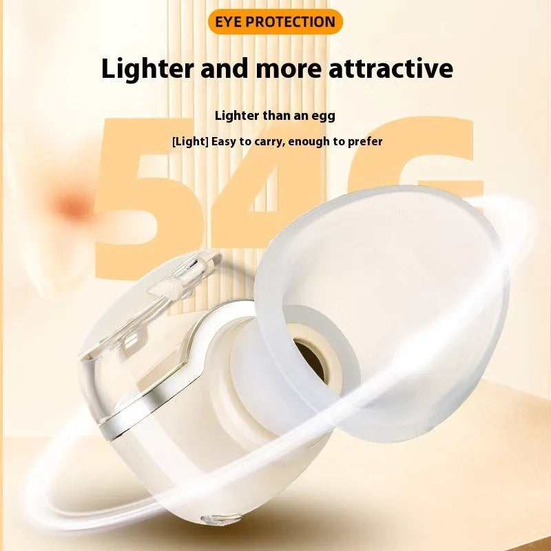 Milky white rechargeable eye moisturising instrument with hot and cold double compress on a desk