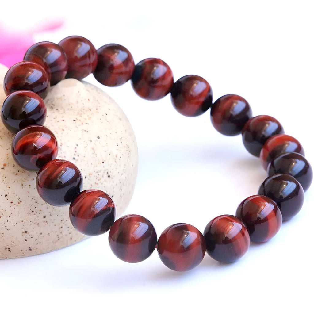 Red wood alexandrite bracelet with lightning cat's eye pattern and geometric beads