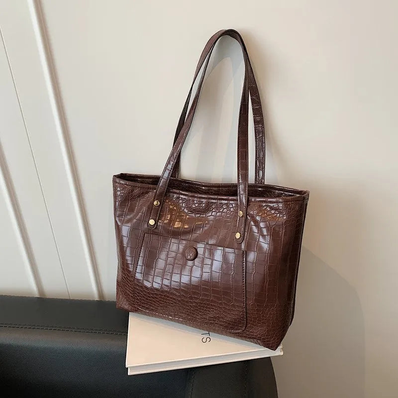 Retro large capacity single-shoulder handbag in soft PU with stitching details, available in black, tan, brown, coffee colours