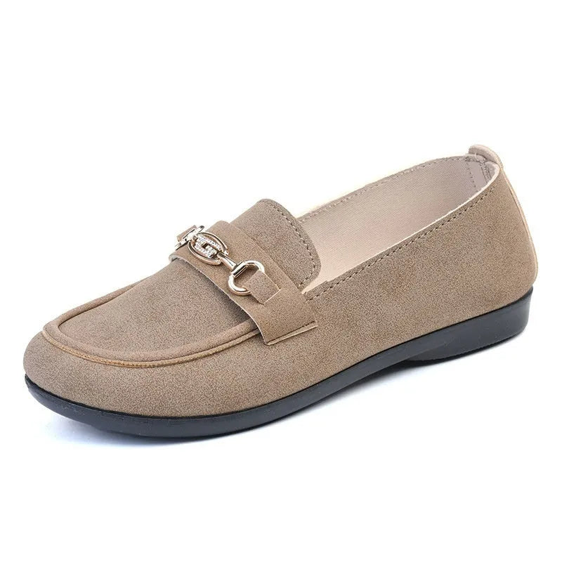 Gommino women's black casual slip-on shoes with round toe and flat rubber sole on a white background.