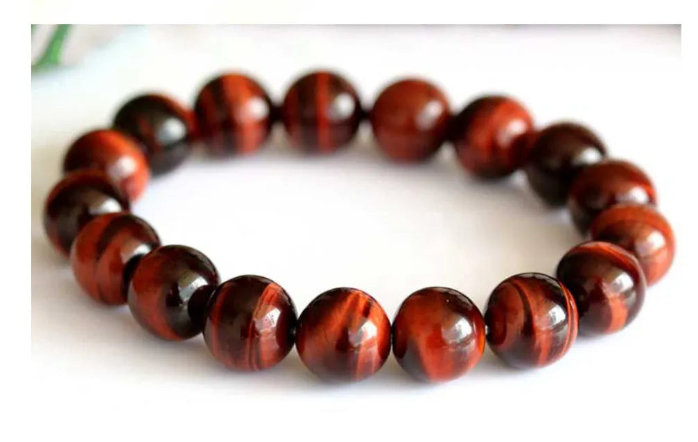 Red wood alexandrite bracelet with lightning cat's eye pattern and geometric beads