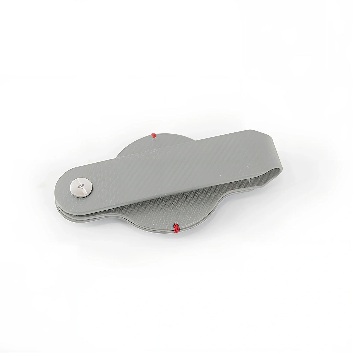 Black PU leather AirTag holder keychain with metal ring, 4cm diameter, secure snap fit for tracking valuables