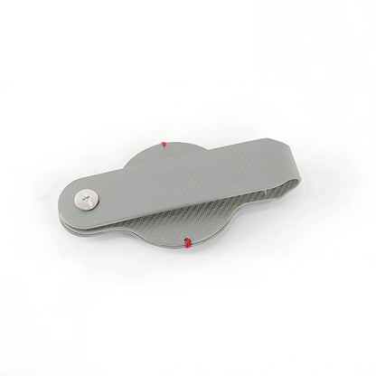 Black PU leather AirTag holder keychain with metal ring, 4cm diameter, secure snap fit for tracking valuables