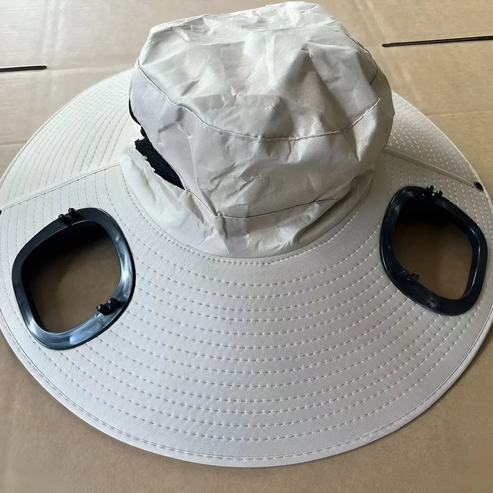 Men's grey solar powered cooling fan cap with large front eave and integrated fan unit