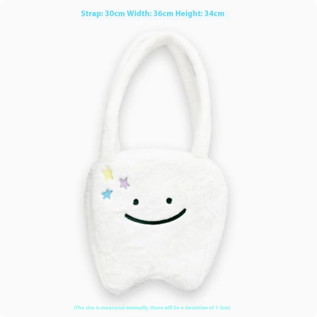 White plush tote bag with a cute teeth graphic, showing the crossbody strap and zipper opening.