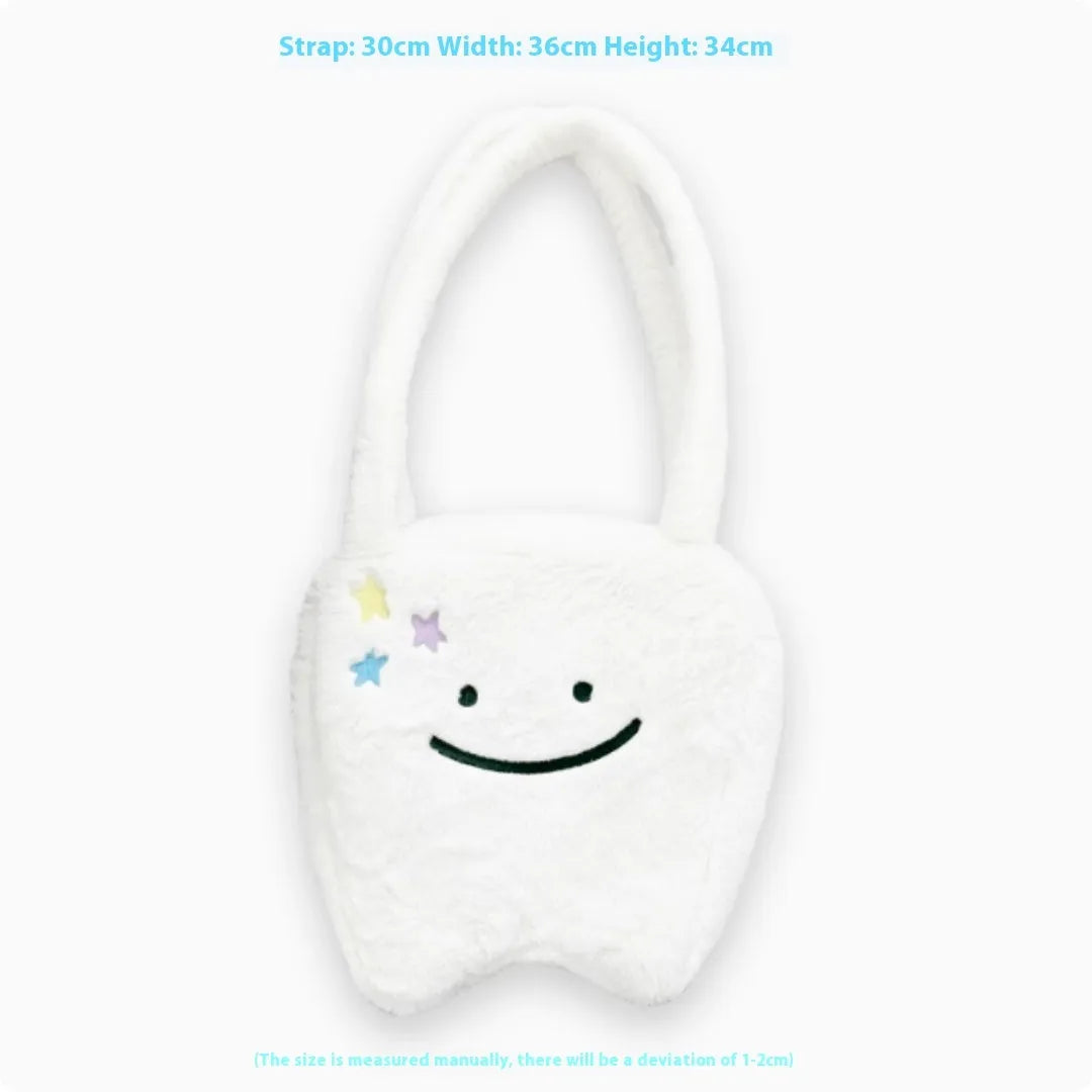 White plush tote bag with a cute teeth graphic, showing the crossbody strap and zipper opening.